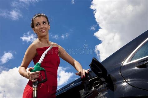 Girl At Gas Station Young Woman With Fuel Nozzle On Gas Station With