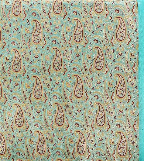 Turquoise Blue Fabric From Banaras With Paisleys Woven In Golden Thread