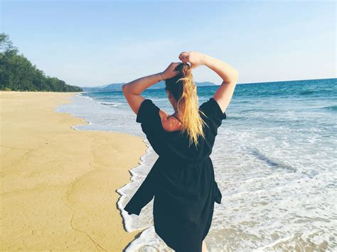 Woman Standing On Sea Shore · Free Stock Photo