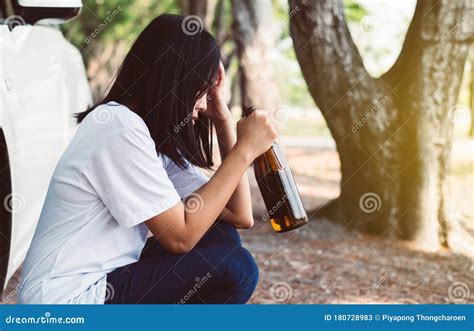 Drunk Asian Girl With Hangover Sleeping In Biergarten With Empty Beer Mugs Royalty Free Stock