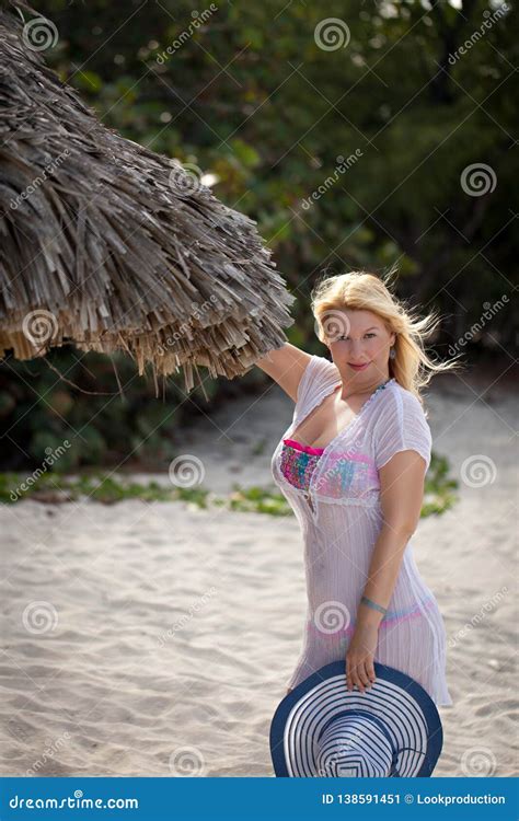 Young Blonde Woman In Bikini And Beach Dress At The Beach Stock Image