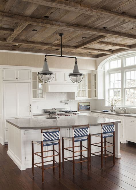Traditional farmhouse kitchens were designed to be working spaces for busy people, and needed to be simple to decorate and maintain. East Coast House with Blue and White Coastal Interiors ...