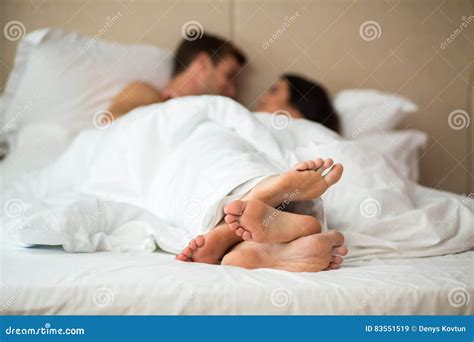 A Couple`s Feet On The Background Of The Sea Royalty Free Stock Image
