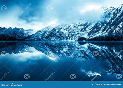 Beautiful Blue Lake In The Mountains Flat Mirror Surface Of The Water