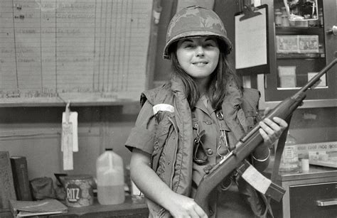 Us Army Nurse In Vietnam Holding An Appropriate Medical Instrument