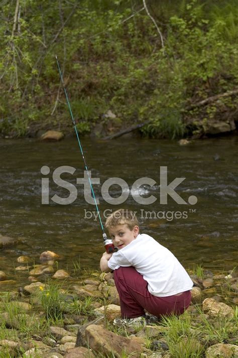 Sitting Boy Fishing Looking Back Stock Photo Royalty Free Freeimages