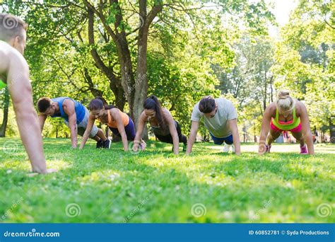 Group Of Friends Or Sportsmen Exercising Outdoors Stock Image Image