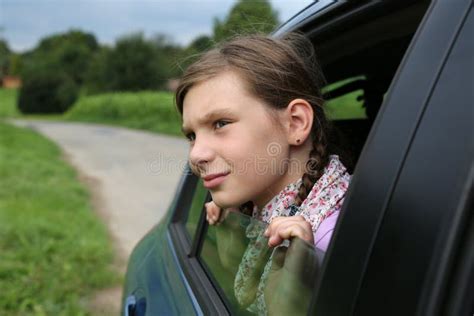 Little Girl Looking Out From The Window Of A Car Stock Photo Image Of