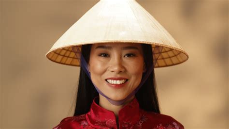 Free Stock Video Close Up View Of Young Asian Happy Woman In Red Clothes And Conus Hat Smiling