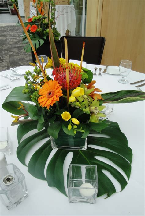 tropical floral centerpieces | Tropical centerpieces, Tropical wedding centerpieces, Tropical ...