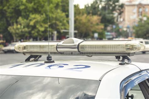 Police Cars With The Siren Lights Off On Patrol Mission Stock Photo