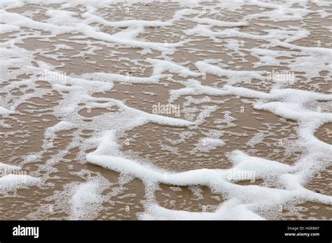 Sea Foam It Is Formed By Strong Wind And Organic Particles On The