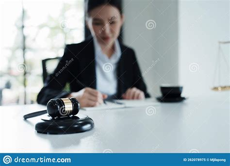 Portrait Of A Beautiful Asian Lawyer Studying A Lawsuit For A Client