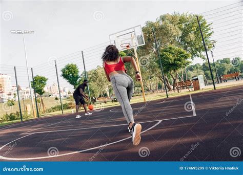 Outdoors Activity African Couple On Basketball Court Girl Running