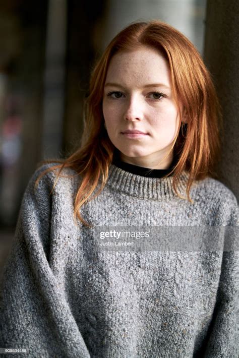 Redhead Teen Looking Intensely At The Camera Standing In The Winter