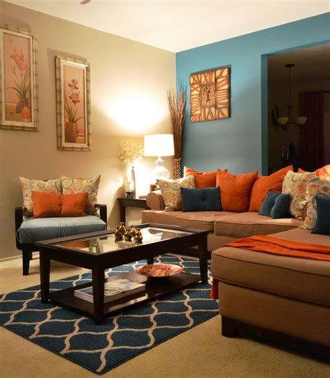 Striking orange leaves against a vibrant teal backdrop. living room orange and brown teal art gallery wall by ...