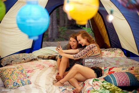 Girls Taking Selfie With Cell Phone In Camping Tent Photo Getty Images