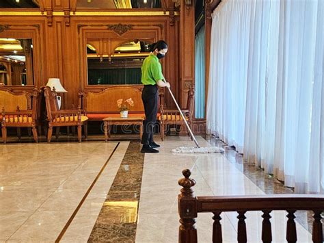 Maid Mopping Hotel Foyer Cleaning Cosy Interior In Hotel Lobby Staff