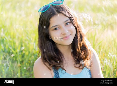 Portrait Of Positive Teen Girl Outdoors In Summer Stock Photo Alamy