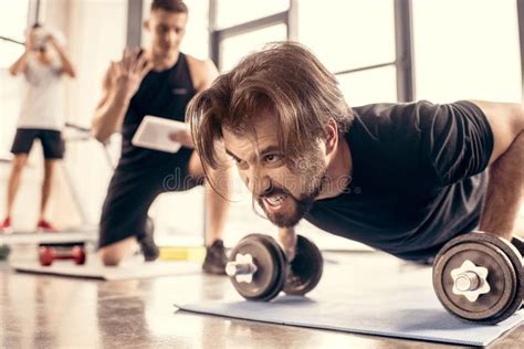 Angry Sportsman Doing Push Ups On Dumbbells Stock Photo Image Of