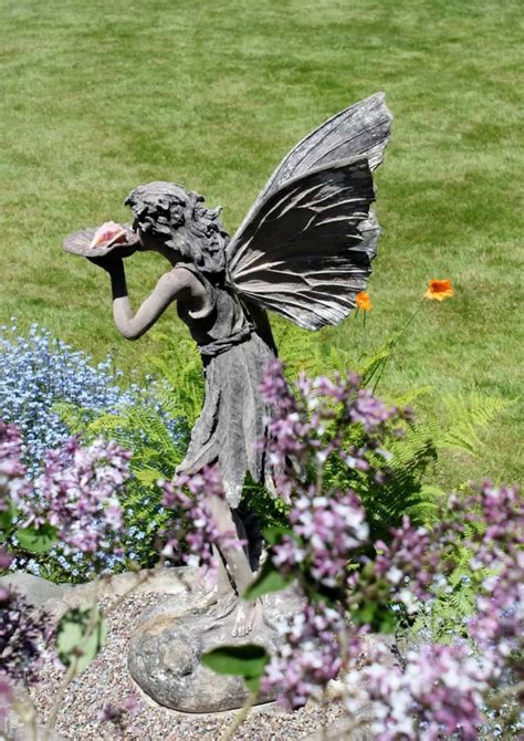 Garden With Perennials And A Fairy Statue Garden Whimsy Love Garden