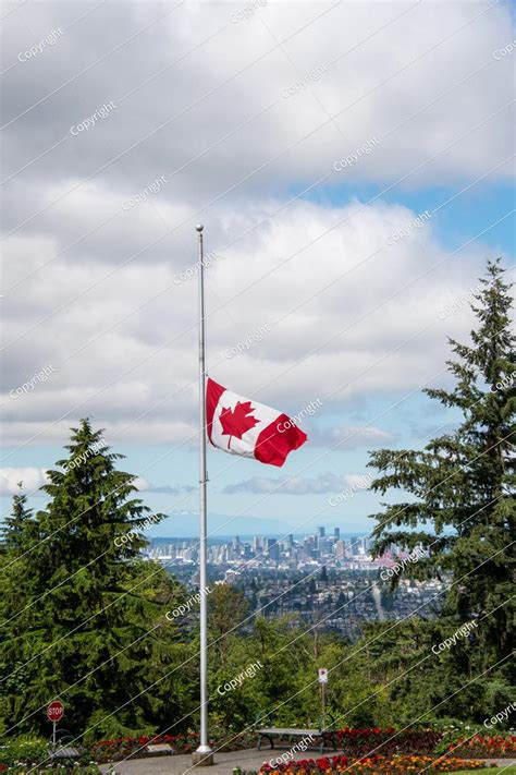 The canadian flag is flown at half mast to represent mourning. Canadian Flag Flying At Half-mast.