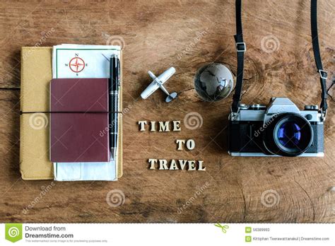 Notebook With Map Passport And Camera On Wooden