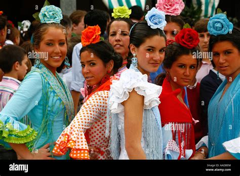 Young Women Wearing Traditional Flamenco Dress At The April Fair