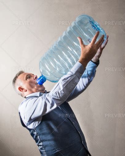 Drinking From A Giant Water Bottle Stock Photos Motion Array