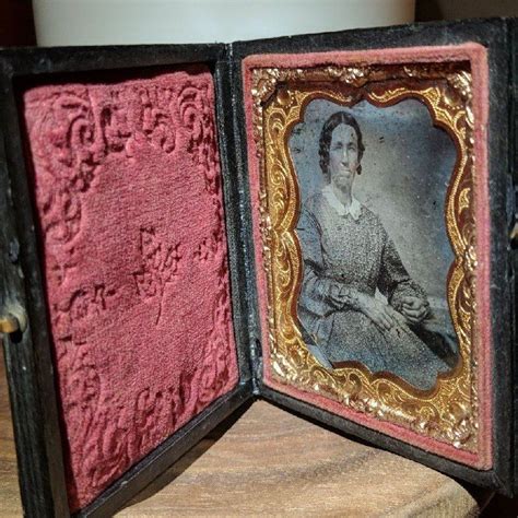 antique tintype photo in folding hard case frame