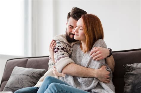 Man Hugging His Girlfriend In The Living Room Free Photo
