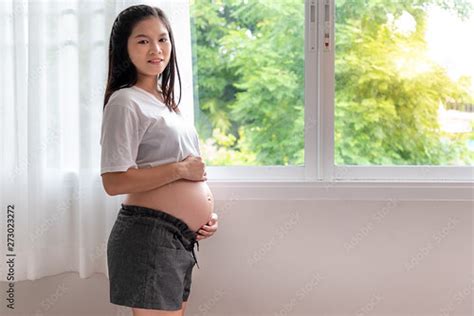 Pregnant Asian Teen Pregnant Asian Teen Touching Her Pregn