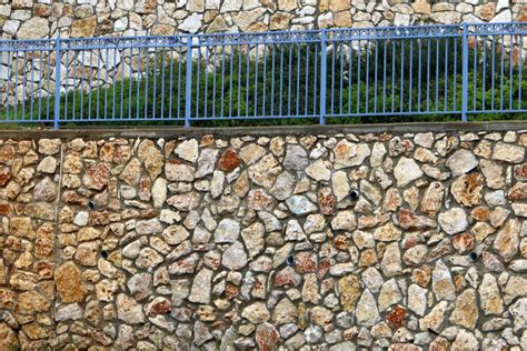 High Wall Made Of Stone And Concrete Stone Wall Texture Stock Photo