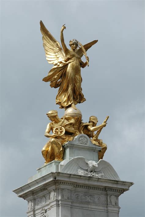 Detail Of Top Of Victoria Monument London Uk Against A Gray Sky