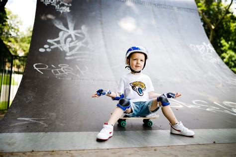 Boy With A Skate In A Skate Park The Boy Learns To Skate In Full