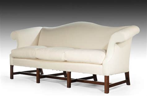 An Attractive Mahogany Framed Camelback Sofa In The Manner Of Thomas