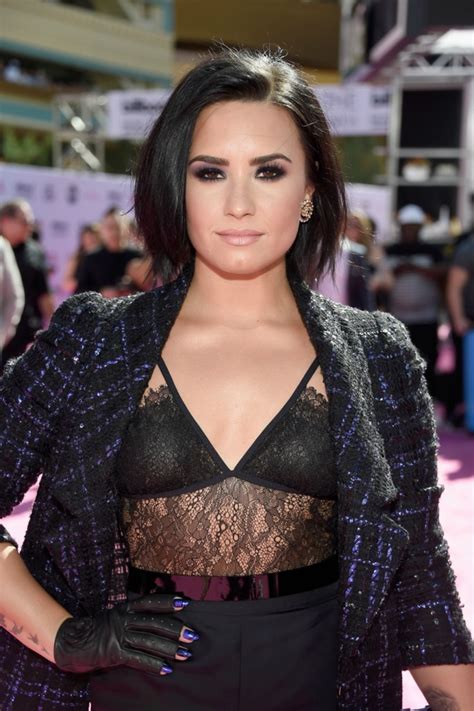 Demi lovato looks sleek in leather as she carries beloved pooch buddy. Demi Lovato, Madonna and Your Mom Wore Fingerless Gloves