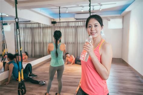 Premium Photo Fitness Woman Drinking Water From Bottle Muscular