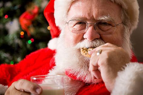 Christmaseatingcookiesanta Claus Stock Photos Pictures And Royalty Free