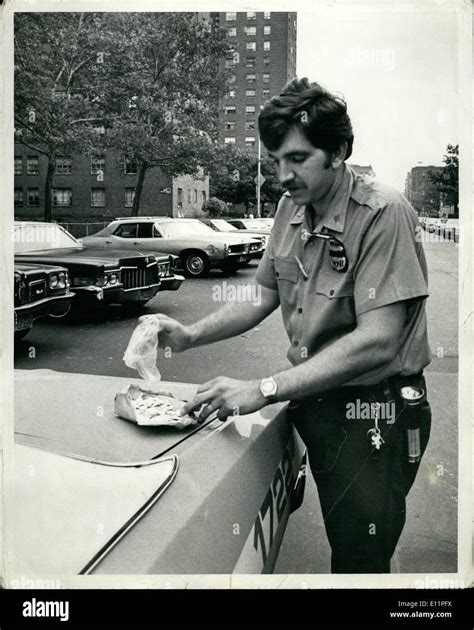 Aug 08 1979 A Police Officer From The 28th Precinct In Harlem Holds