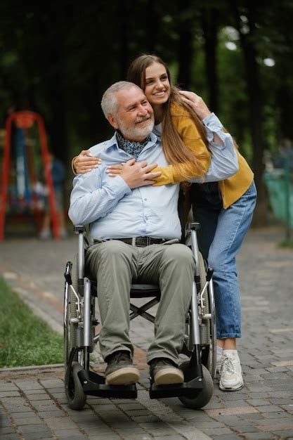 Premium Photo Daughter And Disabled Father In Wheelchair Happy