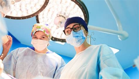 Surgery Medicine And People Concept Three Surgeons In Operating Room