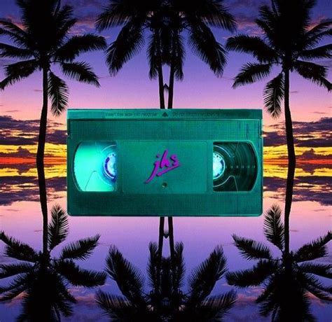 An Old School Cassette Tape Recorder With Palm Trees In The Background