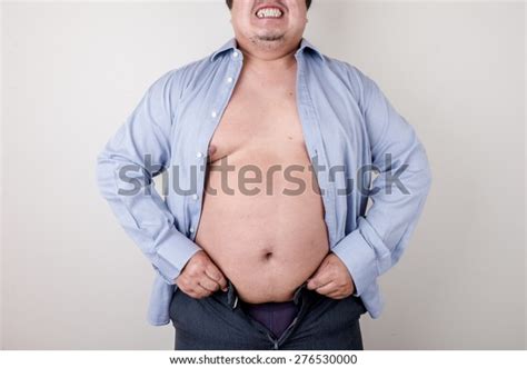 Overweight Man Trying Fasten Small Clothes Stock Photo Edit Now 276530000
