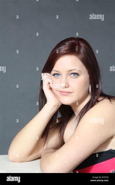 Beautiful Blue Eyed Brunette Teenager With Red Highlights In Her Hair
