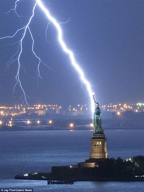 Photographer Captures Image Of Lightning Bolt As It Strikes Statue Of