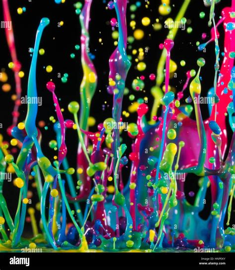 Abstract Sculptures Of Colorful Splashes Of Paint Dancing Liquid On A