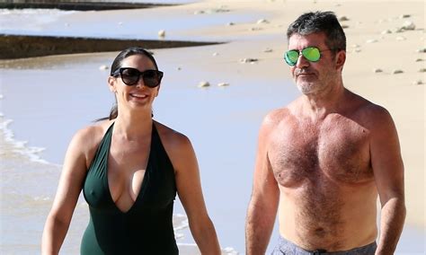 simon cowell goes shirtless at the beach with longtime love lauren silverman lauren silverman