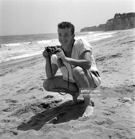 Actor Ben Cooper Takes Pictures Of Dani Crayne At The Beach In Los News Photo Getty Images