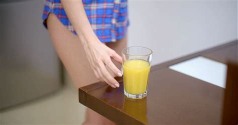 Bottomless Woman Drinking Orange Juice Stock Footage SBV 301819280